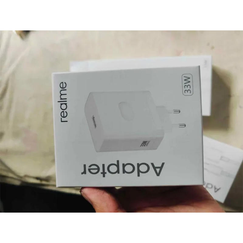 Picture of Realme 33W SuperVOOC Fast Charging PD Power Adapter, which includes a USB to Type-C cable. -Multicolor