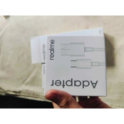Picture of Realme 33W SuperVOOC Fast Charging PD Power Adapter, which includes a USB to Type-C cable. -Multicolor
