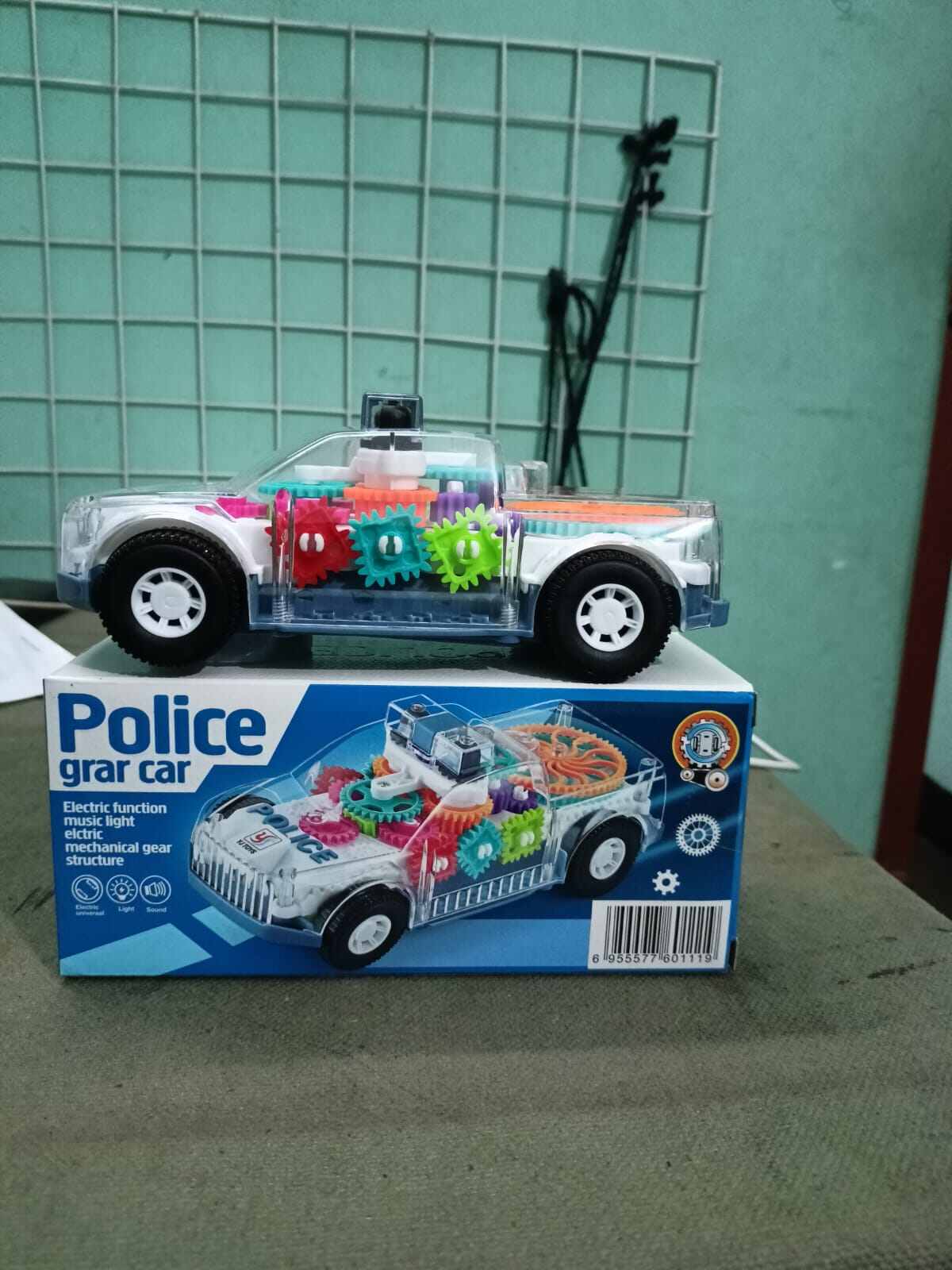 Picture of Battery-Operated Police Car Toy with Lights, Music & Transparent Gears-Multicolor