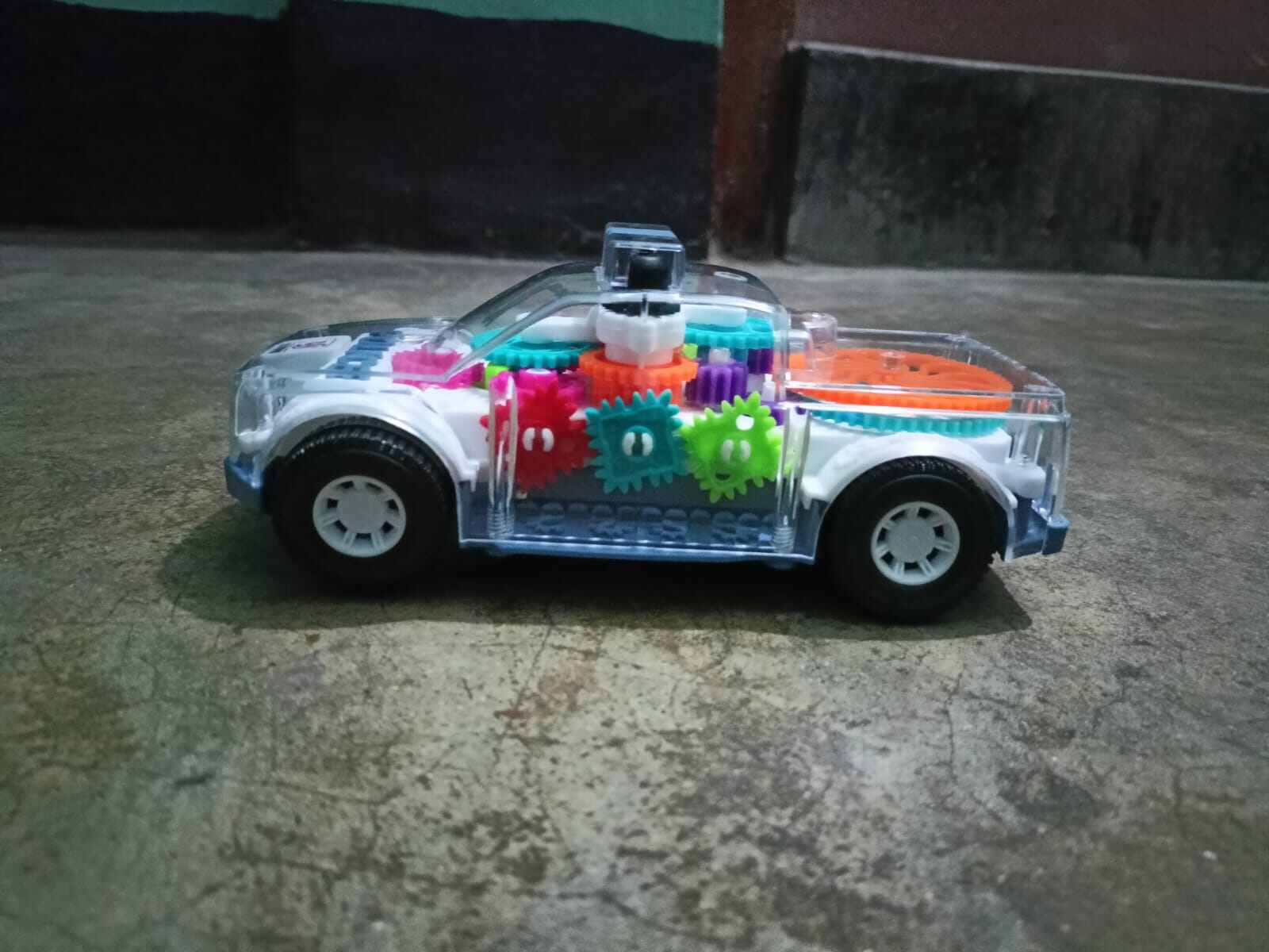Picture of Battery-Operated Police Car Toy with Lights, Music & Transparent Gears-Multicolor
