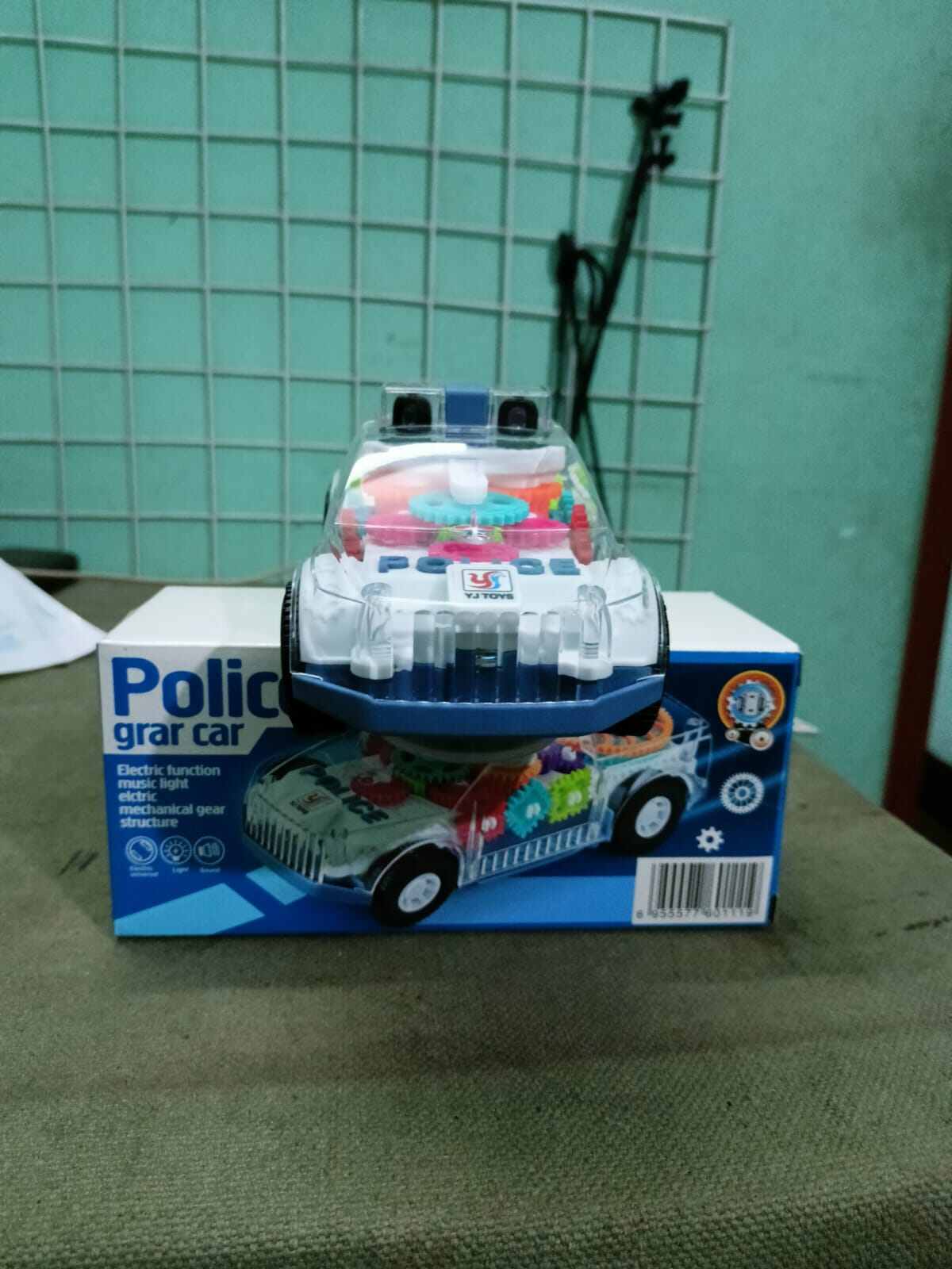 Picture of Battery-Operated Police Car Toy with Lights, Music & Transparent Gears-Multicolor