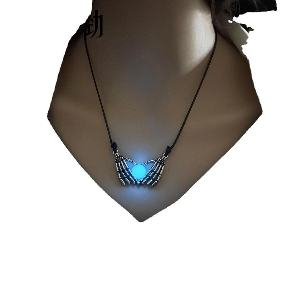 Picture of Product Description: Fashion Halloween Skull Palm Heart Pendant Luminous Necklace Add an eerie yet enchanting touch to your style with the Luminous Skull Palm Heart Pendant Necklace. Blending gothic romance with a playful, spooky vibe, this statement chok - Blue