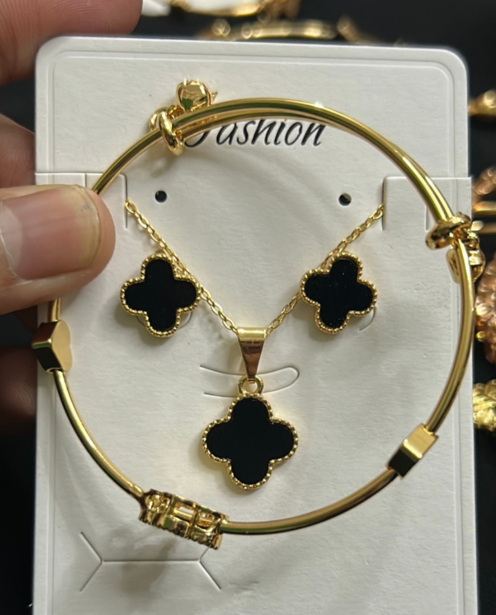 Picture of Women’s Black Clover Gold-Tone Jewelry Set – Bracelet, Necklace & Earrings - Black
