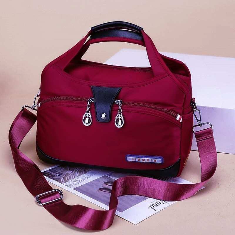 Picture of Large Capacity Waterproof Anti - theft Fashion (Red, Maroon, Black, Purple, Blue) Outdoor Bags Fashionable Travel Back pack Shoulder Bags Lightweight Purses And Handbags Crossbody Bags for Women/ Girls