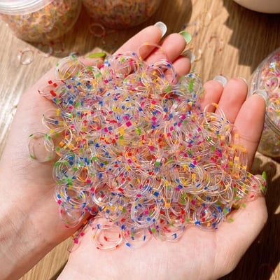 Picture of Super elastic disposable rubber band for girls to tie their hair without damaging the hair Small children's hair rope baby colored rubber band - Multicolor