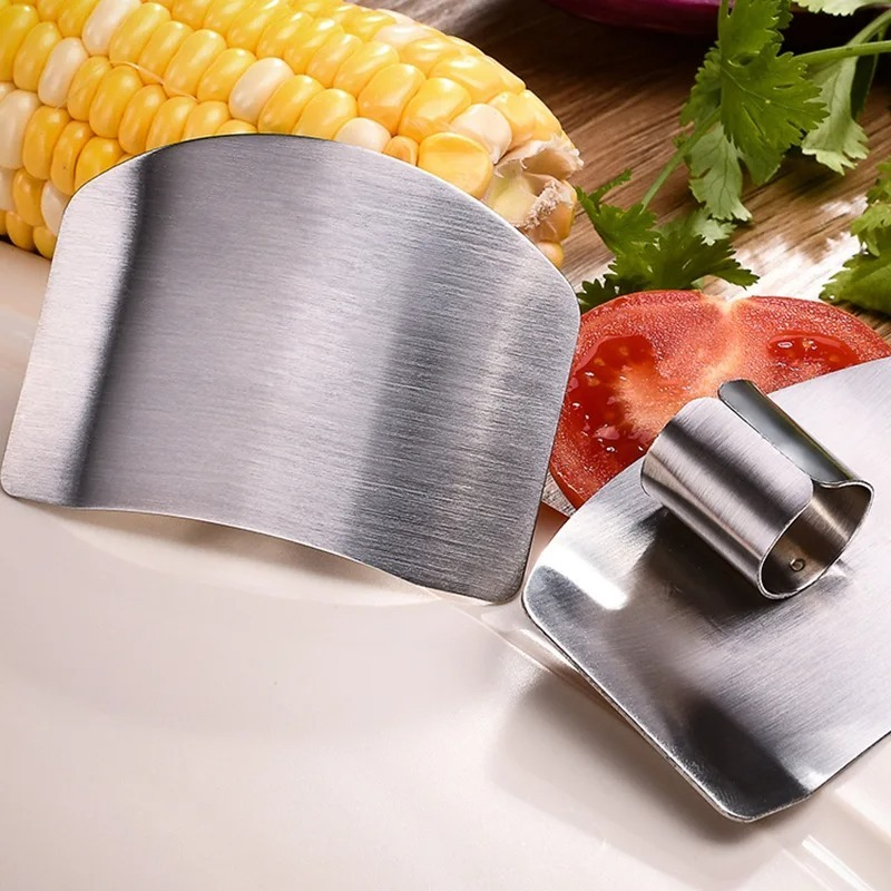 Picture of Stainless Steel vegetable cutter hand guard household finger Guard -kitchen finger Guard tool-The Asia Express-Silver