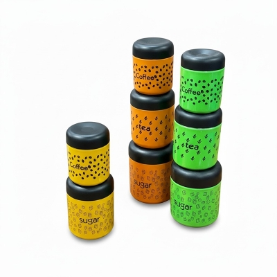 Picture of Vibrant Green Stainless Steel Tea Coffee Sugar Canister Set with Airtight Black Lids, Decorative Food Grade Kitchen Storage Containers featuring Laser Printed Graphics and Stackable Cylindrical Design for Modern Home Organization Essentials.