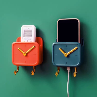 Picture of Buy Multifunctional Clock Shaped Wall Mounted Mobile Phone Holder Charging Stand with Double Hooks and Waterproof Plastic Material Creative Storage Rack for Home Office Kitchen Bathroom Bedroom use at Best Price.