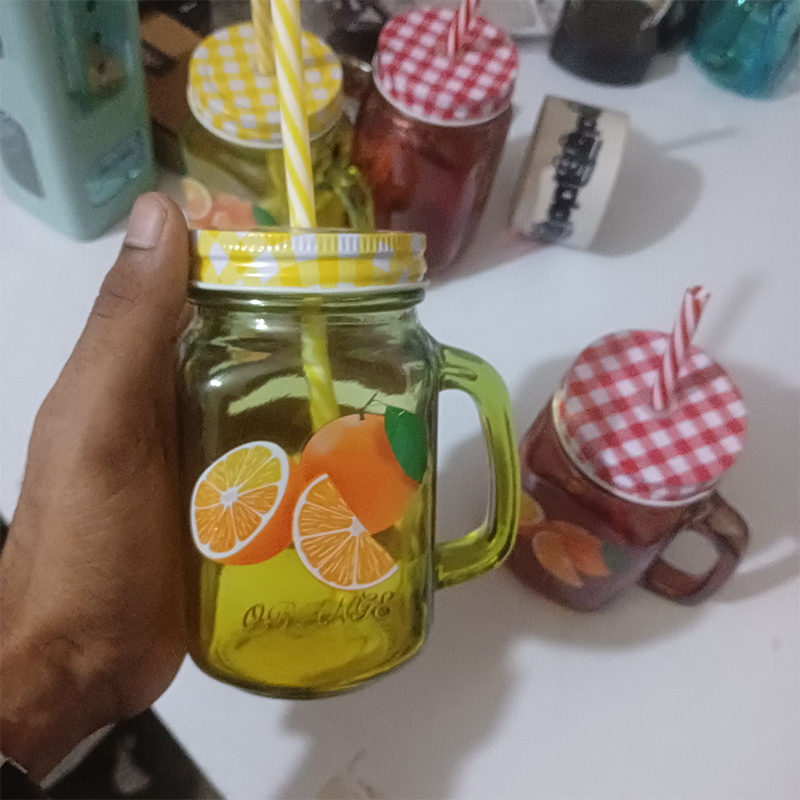 Picture of 1pcs  glass Mason jar mug with a handle, a checkered lid, and a striped straw, designed with print print body for drinking beverages. 