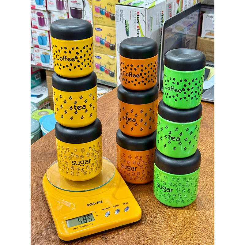 Picture of Vibrant Green Stainless Steel Tea Coffee Sugar Canister Set with Airtight Black Lids, Decorative Food Grade Kitchen Storage Containers featuring Laser Printed Graphics and Stackable Cylindrical Design for Modern Home Organization Essentials.
