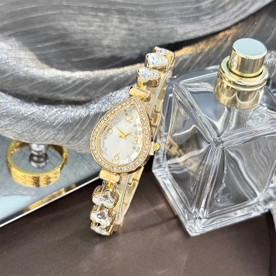 Picture of Elegant freestyle quartz watch for women with embedded diamonds, water drop shaped water box, colorful heart braceletBlue, Pink, Black, Red, Off White