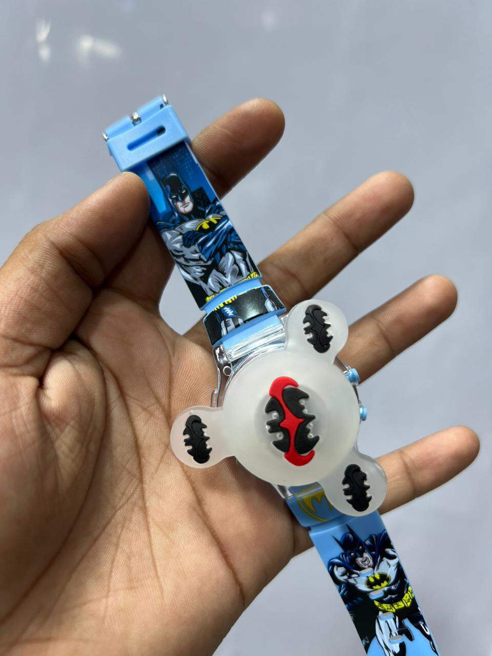 Picture of Time Up Digital Dial Cartoon Revolving Cap Glowing Light Cartoon Printed Strap Colorful Kids Watch for Boys & Girls (Age:4-12 Years) -RC56-YPurple, Royal Blue, Red, Black, Blue