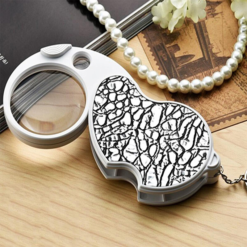 Picture of Double Lens LED Magnifying Glass Folding Keychain Handheld Illuminated Magnifies Pocket Size Lens Size (8x37mm, 20x12mm) Multicolor