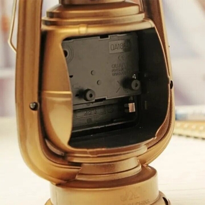 Picture of Antique Style Hurricane Lantern Table Clock | Decorative Metal Lantern Clock for Mantel & Office | Retro Kerosene Lamp Aesthetic | Farmhouse Shelf Decor | Unique Housewarming Gift | Bronze Finish Desktop Timepiece | Nostalgic Interior Accent-Multicolor