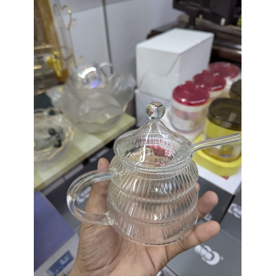 Picture of Premium 10oz Beehive Glass Juice Pot with Stirring Rod and Lid crafted from heat-resistant borosilicate glass perfect for serving fresh orange juice or fruit infusions at your modern breakfast dining table.