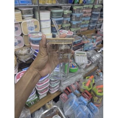 Picture of glass tumbler with a bamboo lid and a reusable glass straw,
