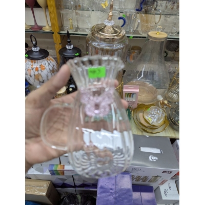 Picture of Elegant fluted borosilicate glass pitcher with pink butterfly motif and scalloped rim for serving fresh orange juice lemonade or iced tea at sophisticated garden parties brunch gatherings and stylish home dining events.