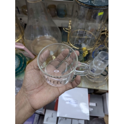 Picture of Minimalist Clear Borosilicate Glass Coffee Mug with Black 'COFFEE' Lettering and Heart Icons, 13oz Heat Resistant Transparent Tea Cup for Home Office Latte Espresso Milk, Durable Lightweight Glassware Gift for Coffee Lovers.