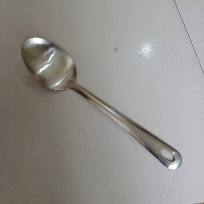 Picture of 10 Inch Stainless Steel Serving Spoon, Silver, Non-Magnetic, Perfect for Cooking and Serving. Durable and Versatile, This Spoon Offers Efficiency and Style in Any Kitchen.-Silver