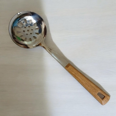 Picture of 10 Inch Stainless Steel Round Slotted Kitchen Spoon, Silver, with Non-Magnetic Wooden Color Plastic Handle, Ideal for Cooking and Serving. This Durable and Stylish Spoon Enhances Versatility and Elegance in Your Kitchen.-Silver