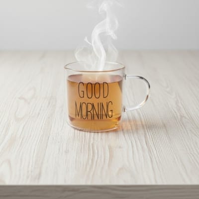 Picture of Premium Good Morning Glass Mug made from high-quality borosilicate glass, featuring a clear heat-resistant body and ergonomic handle, perfect for serving hot coffee, herbal tea, milk, or fresh fruit juice.-Multicolor