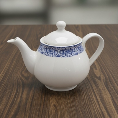 Picture of Elegant White Porcelain Teapot Featuring Intricate Navy Blue Floral Pattern for Premium Afternoon Tea Service Experiences.-Multicolor