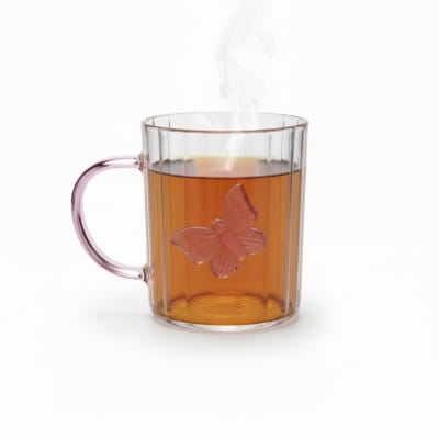 Picture of Elegant 3D butterfly high borosilicate glass mug featuring a heat resistant vertical striped fluted design and pink colored handle perfect for hot coffee herbal tea or as a charming decorative kitchen accessory.-Multicolor
