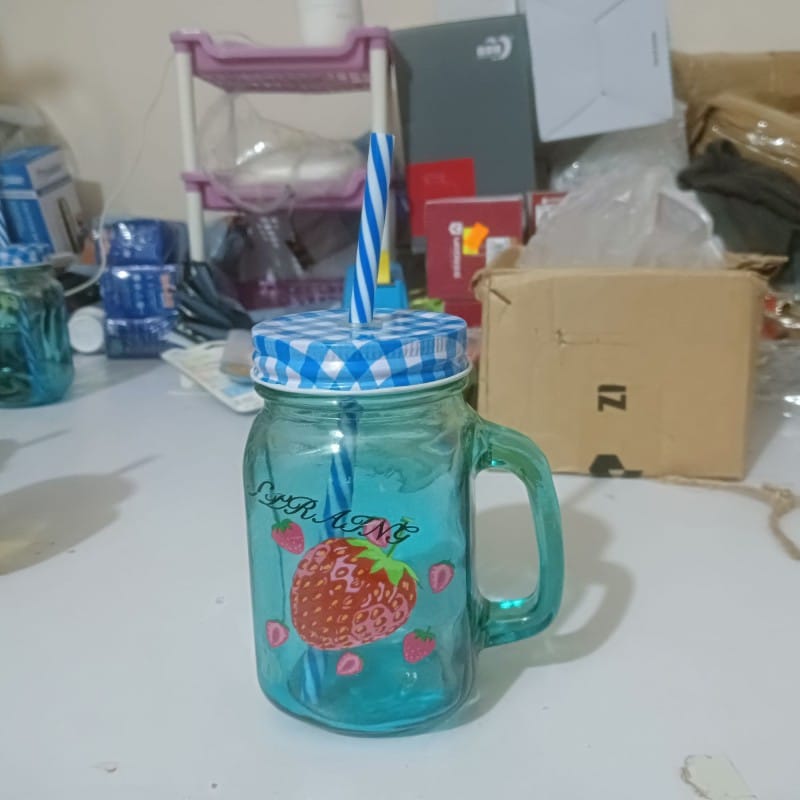 Picture of 1pcs blue glass Mason jar mug with a handle, a checkered lid, and a striped straw, designed with print print body for drinking beverages. -Blue