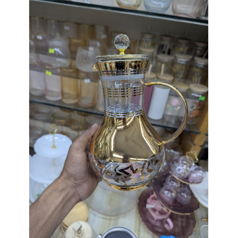 Picture of Premium luxury golden glass jug for dining table stylish 1700ml capacity heat resistant borosilicate glass water pitcher with lid and crystal knob perfect for serving cold juice tea and beverage items.-Gold
