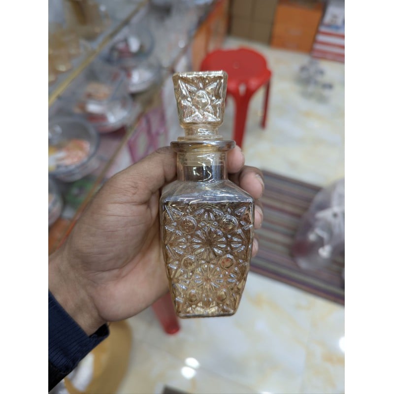 Picture of Elegant Square Diamond-Cut Glass Whiskey Decanter Bottle with Airtight Decorative Stopper - Premium Lead-Free Crystal Carafe for Storing Scotch, Bourbon, Brandy, and Liquor - Stylish Home Bar Display and Professional Beverage Service.-Gold