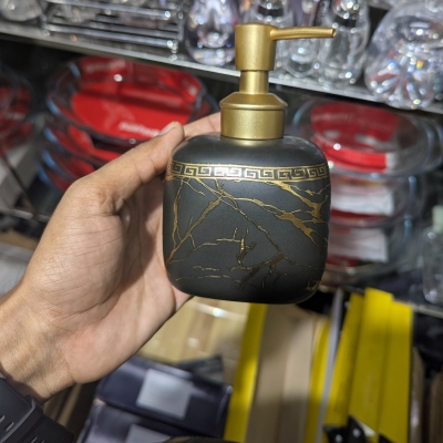 Picture of Luxury black marble ceramic soap dispenser featuring a stunning gold Greek key pattern around the neck and a premium gold pump perfect for enhancing your sophisticated bathroom vanity or modern kitchen decor.-black