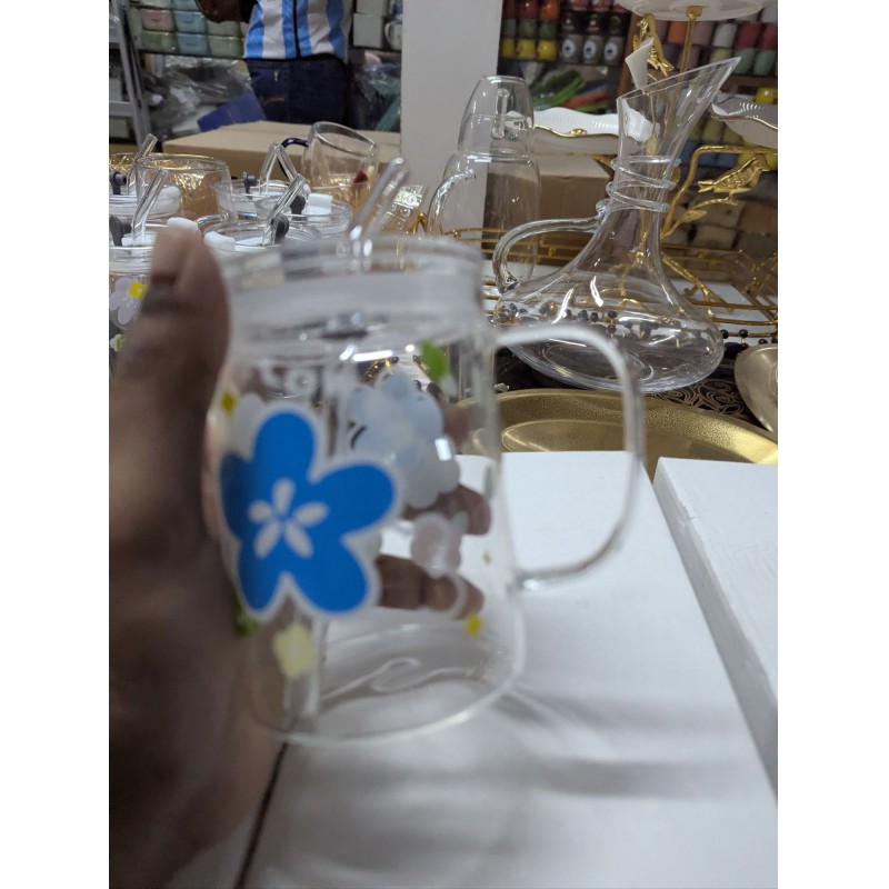 Picture of Floral Design Premium Glass Jar Mug with Handle, Airtight Leak-Proof Lid, and Reusable Straw for Coffee, Milkshakes, Juice, or Water; Elegant Heat-Resistant Borosilicate Drinkware Container Perfect for Stylish Home and Gift.-Multicolor
