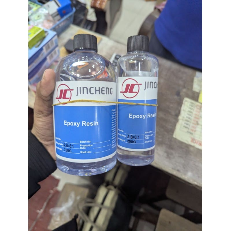 Picture of Buy JINCHENG 1kg Crystal Clear Art Epoxy Resin Kit with a precise 3:1 Mixing Ratio featuring a fast-cure formula for professional-grade jewelry making, high-gloss wood coating, and creative DIY crafts.-Multicolor