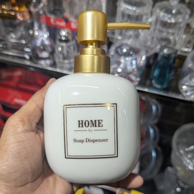 Picture of Luxury white marble ceramic soap dispenser featuring a premium gold-toned pump and decorative HOME printed label perfect for enhancing your bathroom vanity decor or modern kitchen sink countertop with elegant style today.-white