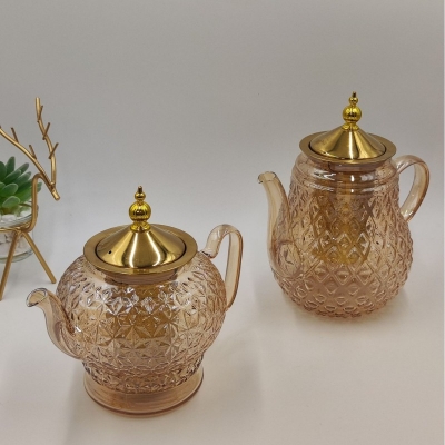 Picture of High Borosilicate Resistant tea kettlee golden colour stainless steem lid and infuser , Large Capacity, High Aesthetic Value, Household Teapot, Juice, Beverage, Light Waight 620 ml-Gold