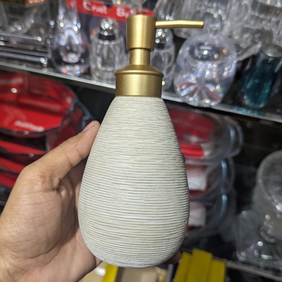 Picture of Elegant white ribbed ceramic soap dispenser featuring a premium gold-toned pump mechanism perfect for enhancing your bathroom vanity decor or modern kitchen sink countertop with a sophisticated and timeless touch of style.-Multicolor