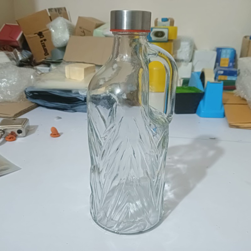 Picture of Stay refreshed: 1-liter transparent glass water bottle with airtight stainless steel cap for water, juice, and daily use – perfect for travel, gym, and home.-Multicolor