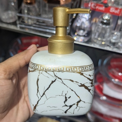 Picture of Luxury white marble ceramic soap dispenser featuring a stunning gold Greek key pattern around the neck and a premium gold pump perfect for enhancing your sophisticated bathroom vanity or modern kitchen decor.-white
