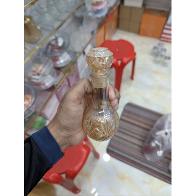 Picture of Premium Vintage Amber Crystal Glass Decanter with Diamond-Cut Base and Matching Geometric Stopper for Whiskey, Wine, or Spirits; Elegant Decorative Vessel Featuring Lead-Free Hand-Painted Gold Detailing for Luxury Home Barware Collection-Gold