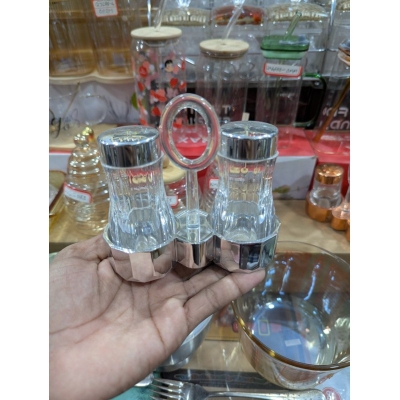 Picture of Premium Clear Acrylic Salt and Pepper Shaker Set with Chrome Finished Lids and Portable Ring Handle Stand, Elegant Transparent Condiment Dispenser Caddy for Home Kitchen Dining Table and Professional Restaurant Tableware.-Multicolor
