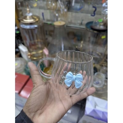 Picture of Aesthetic Japanese Style Pumpkin Shaped Glass Coffee Mug Featuring a Cute 3D Blue Bowknot Decoration Heat Resistant Borosilicate Glass Tea Cup with Large Ergonomic Handle for Elegant Home Office Beverage Service Decor.-Multicolor