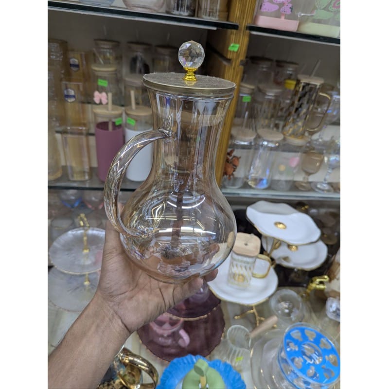 Picture of Premium Borosilicate Glass Water Pitcher with Elegant Golden Lid and Crystal Knob Top for Serving Refreshing Iced Tea Fresh Juice and Cold Beverages during Special Family Gatherings and Daily Home Dining Use.-Gold