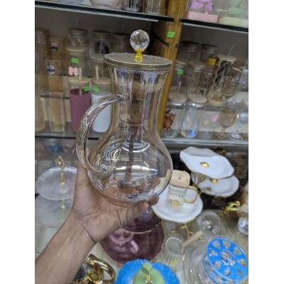 Picture of Premium Borosilicate Glass Water Pitcher with Elegant Golden Lid and Crystal Knob Top for Serving Refreshing Iced Tea Fresh Juice and Cold Beverages during Special Family Gatherings and Daily Home Dining Use.-Gold
