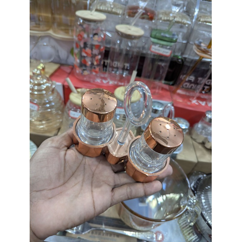Picture of Premium Quality Glass Salt and Pepper Shaker Set with Stylish Metal Carrying Stand, Ideal Kitchen Condiment Dispenser and Dining Table Spice Container Perfect for Home Use, Restaurants, and Elegant Tabletop Organization.-Multicolor