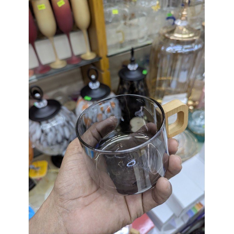Picture of Premium Smoky Grey Borosilicate Glass Coffee Mug with Ergonomic Natural Walnut Wood Handle, Heat-Resistant Glassware Perfect for Hot Espresso, Latte, and Gourmet Tea Lovers Seeking Elegant and Minimalist Home Decor.-Black