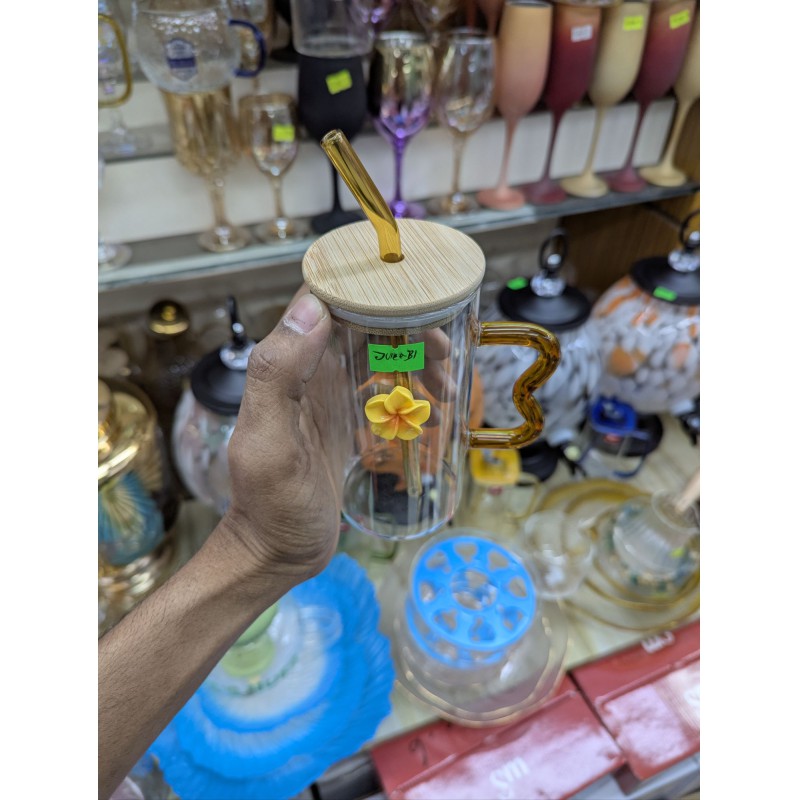 Picture of Premium High Borosilicate Square Pookie Glass Mug featuring a stylish yellow flower charm, durable bamboo lid, matching glass straw, and an ergonomic wavy amber handle for the ultimate aesthetic drinking experience today.-Multicolor