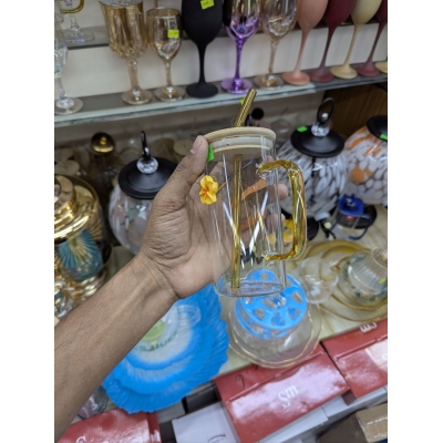 Picture of Aesthetic square glass tumbler with bamboo lid and yellow glass handle plus reusable glass straw featuring a cute flower charm perfect for iced coffee milk tea and fruit juice serving at home.-Multicolor