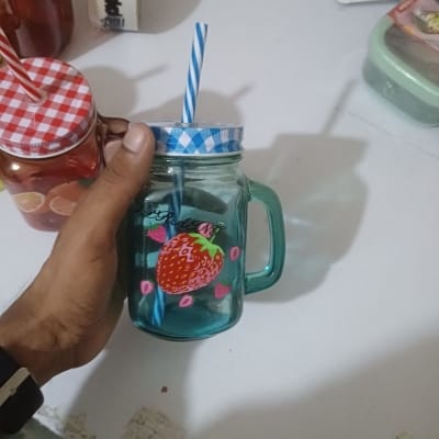 Picture of 1pcs blue glass Mason jar mug with a handle, a checkered lid, and a striped straw, designed with print print body for drinking beverages. -Blue
