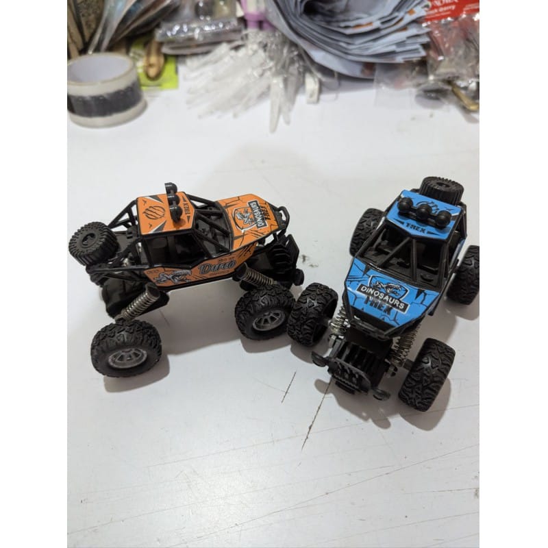 Picture of Durable  Pull Back Monster Truck with High Elastic Metal Shock Absorbers Manual Spring System Off-Road Climbing Car Toy for Toddlers Kids Boys Girls Ages 3 to 10 Years Old.-Multicolor