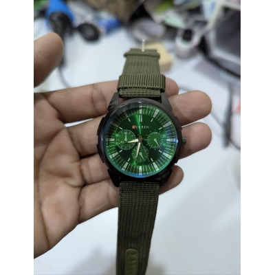 Picture of Men's Sports Analog Quartz Watch featuring a Stylish Green Dial and Durable Olive Green Nylon Fabric Strap, Perfect for Casual Wear and Outdoor Activities for Fashionable Men in Bangladesh Today.-Green
